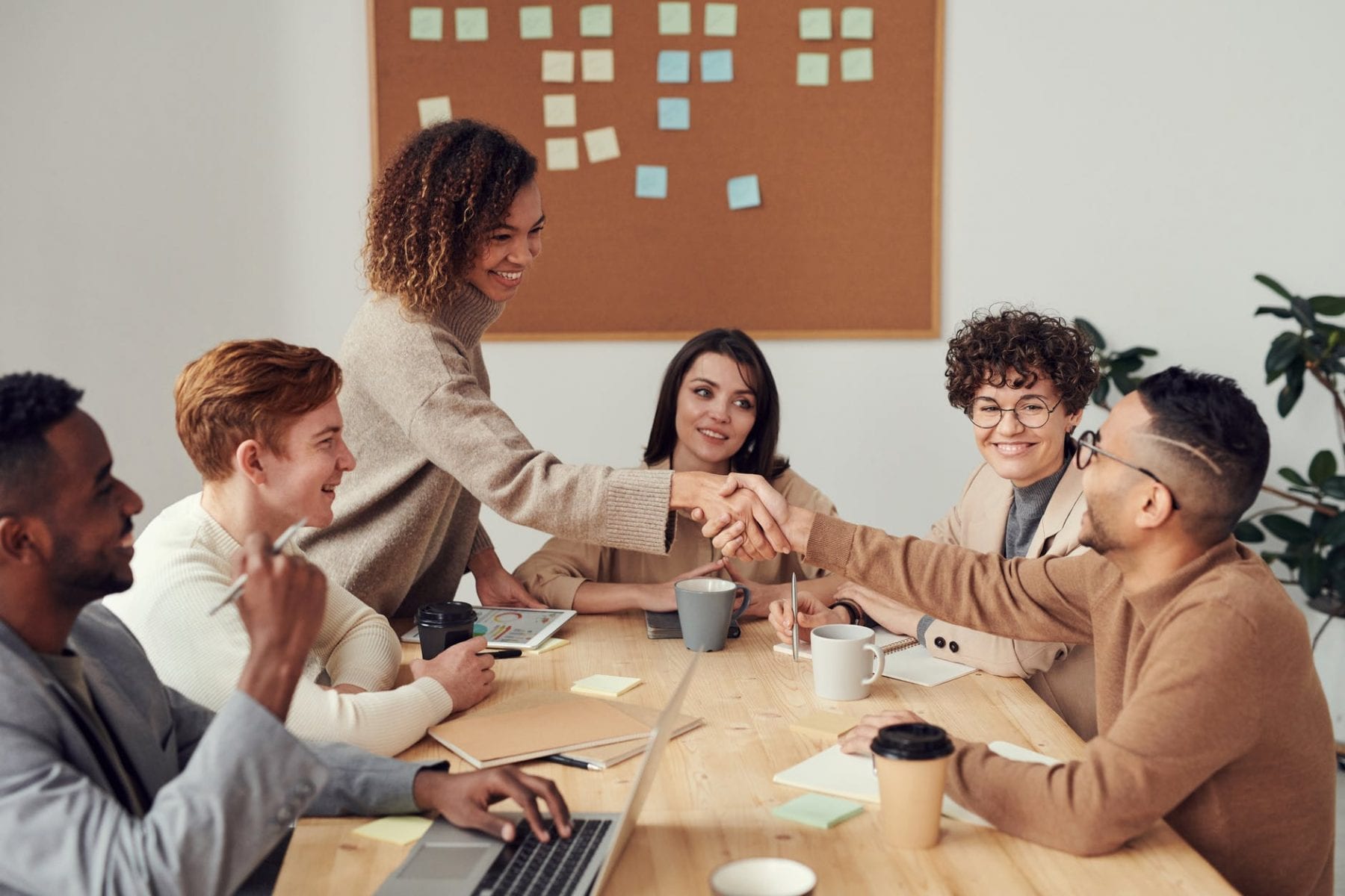 group of adults talking around a table